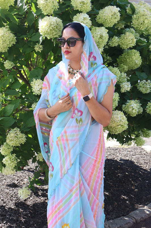 Pastel Blue Georgette Saree with Multicolor Stripes & Floral Embroidery – Lightweight Party Wear