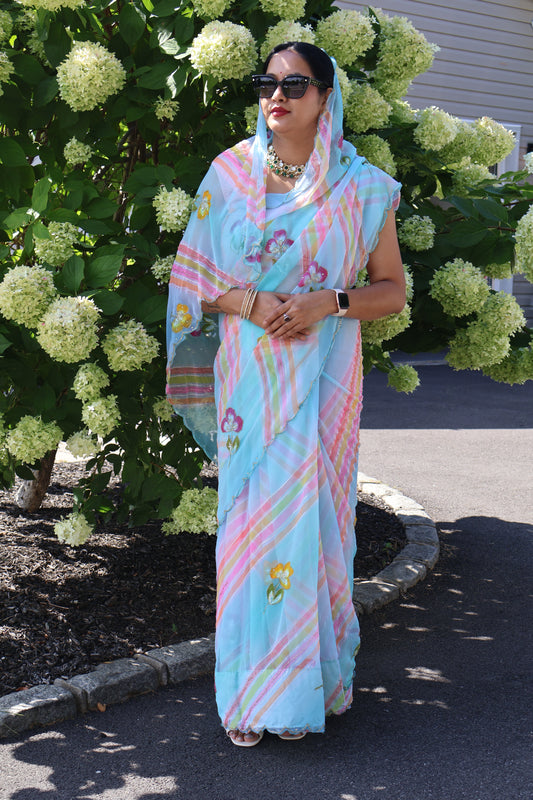 Pastel Blue Georgette Saree with Multicolor Stripes & Floral Embroidery – Lightweight Party Wear